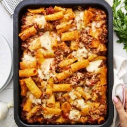 Baked Ziti with Melted Cheese and Pasta in Baking Dish.