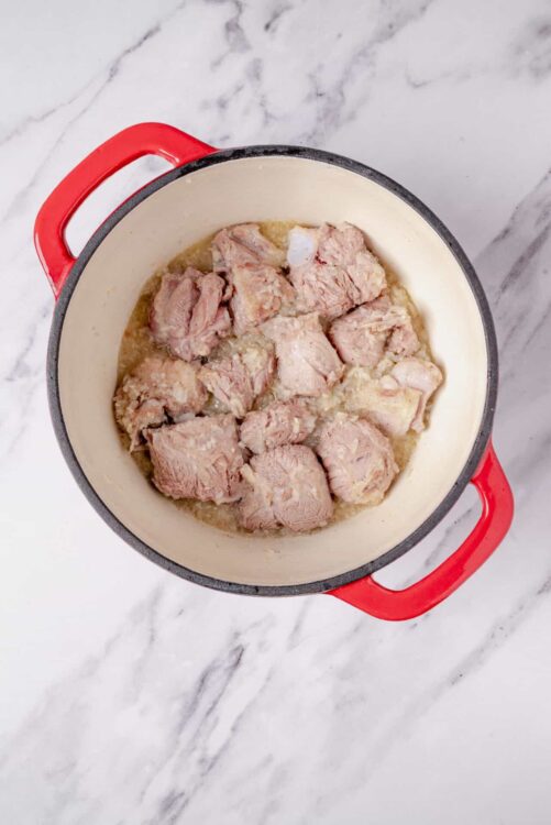 Cooking chicken in a pot for baked chicken recipe.