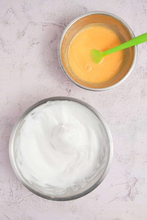 Fluffy whipped cream and a bowl of beaten eggs for baking.