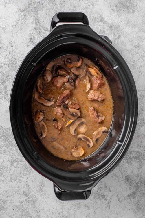 Savory mushroom and beef stew in slow cooker.