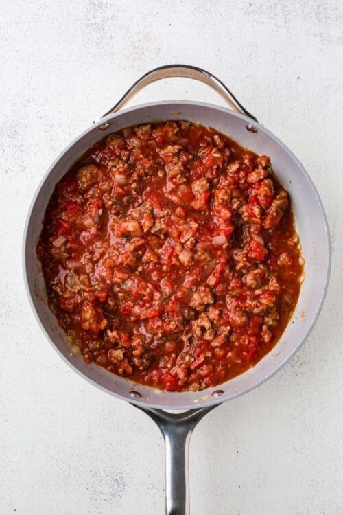 Savory homemade beef Bolognese sauce in a stainless steel skillet.
