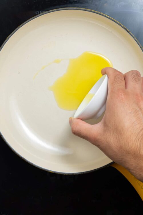 Butter melting in a skillet for cooking or baking purposes.