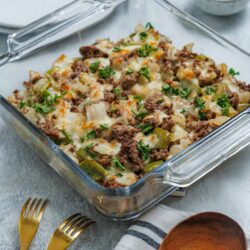 Savory beef and vegetable casserole with melted cheese and fresh herbs. Perfect comfort food for dinner.