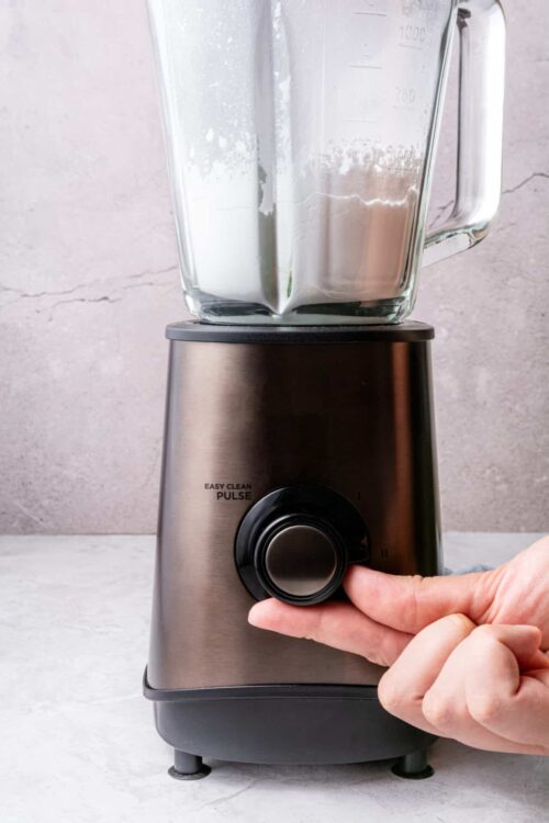 Blender with flour inside for baking recipes.