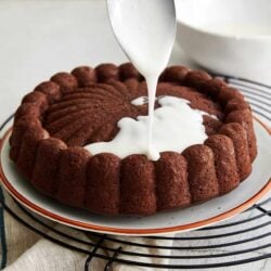 Fudgy chocolate cake with pouring cream, baked Bree dessert, rich and decadent baked goods, perfect for special occasions or dessert.