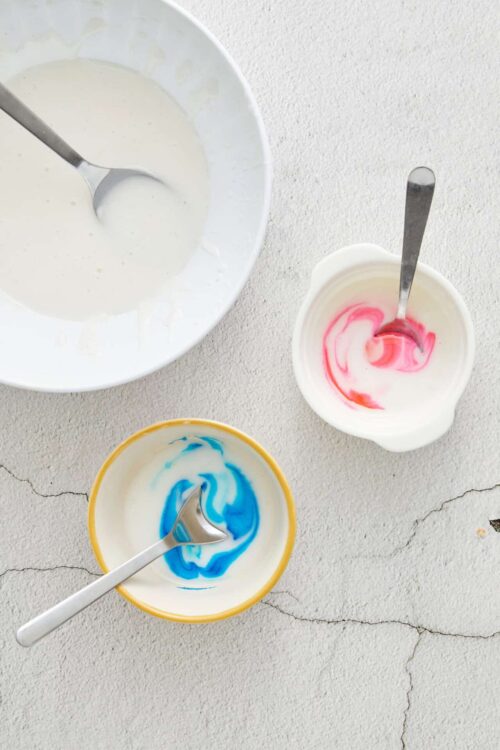 Colorful food coloring in bowls for baking or cooking.