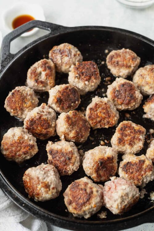 Tender homemade meatballs cooked in a cast iron skillet, perfect for family dinners and easy meal prep.