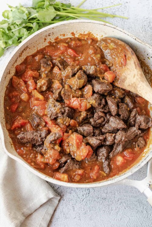 Savory beef stew with tender beef chunks, carrots, and tomatoes in a hearty broth. Perfect comfort food for chilly days.