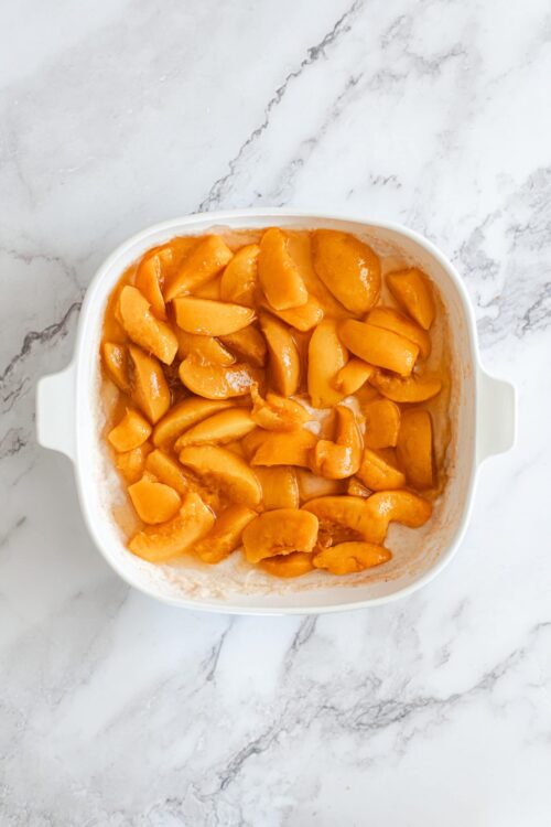 Sweet canned peaches in syrup, ready for baking or dessert recipes.