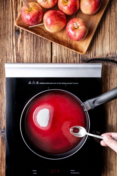 Fresh apples on a wooden tray, ready for baking or cooking recipes.