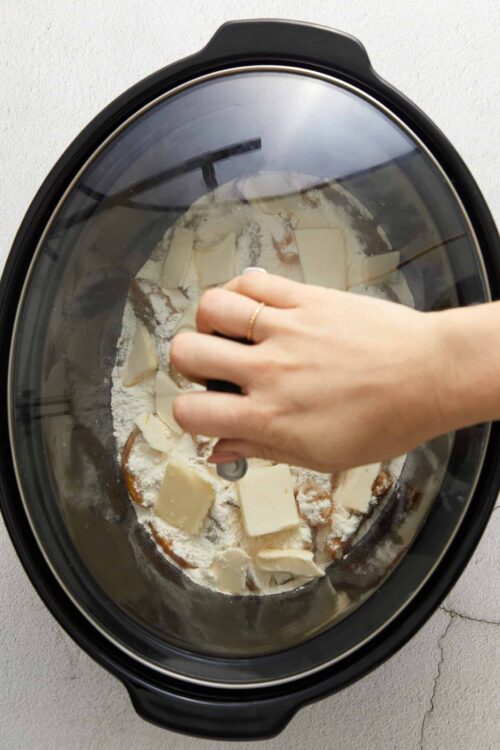 Buttery cookie dough in a slow cooker, ready to bake or chill.