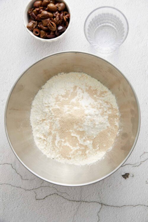 Fine flour mixture with yeast in a baking bowl, ready for baking.