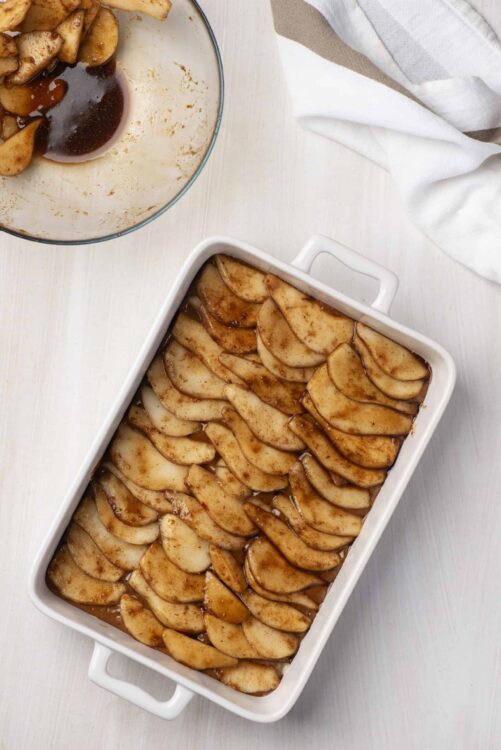 Sweet baked apples in cinnamon and brown sugar syrup, perfect for dessert or fall recipes.