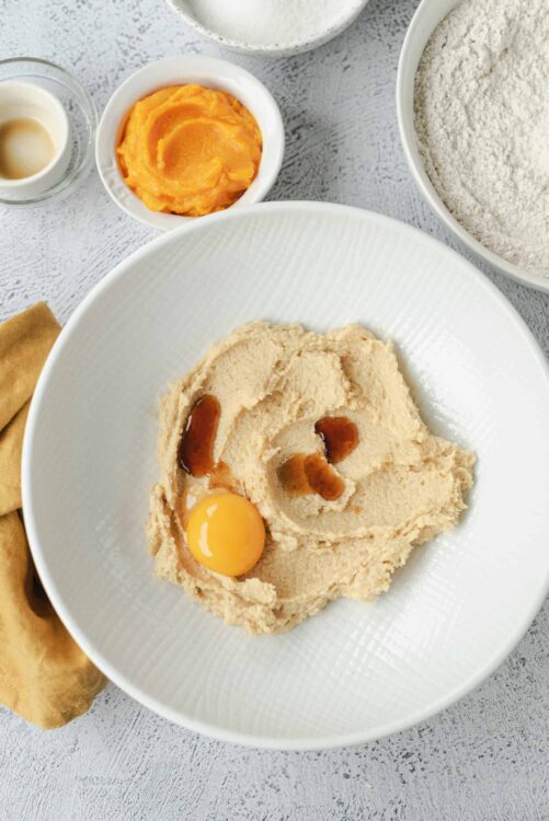 Flour and baking ingredients on textured surface for baking bread or pastries.