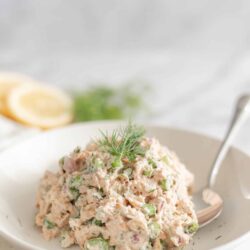 Creamy seafood salad with fresh herbs and vegetables, perfect for light lunches or picnics. Clams, celery, and dill in a flavorful mayonnaise dressing.