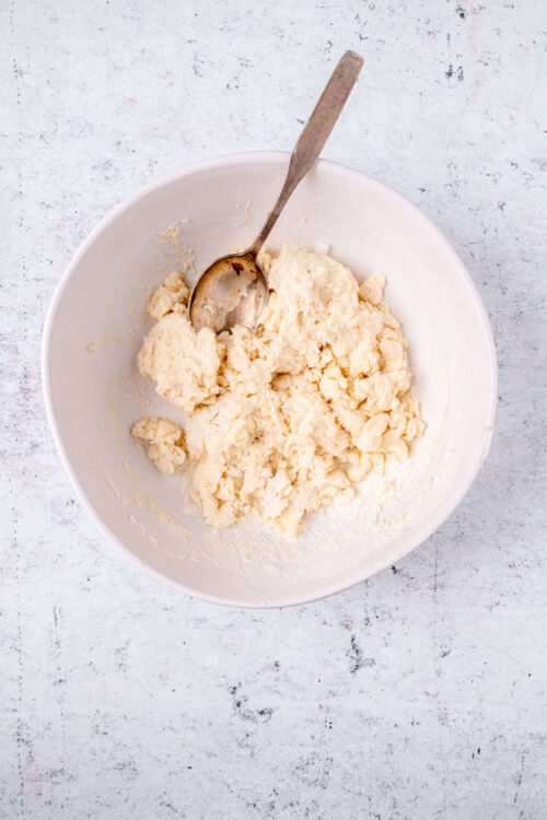 Butter and flour mixture in a white bowl for baking bread or pastries.