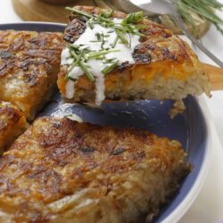 Crispy potato hash casserole with sour cream and chives.