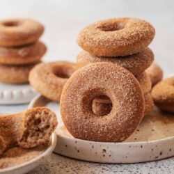 Crunchy cinnamon sugar donuts arranged on a rustic plate.