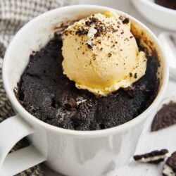 Rich chocolate lava cake with vanilla ice cream and crushed cookies on top.