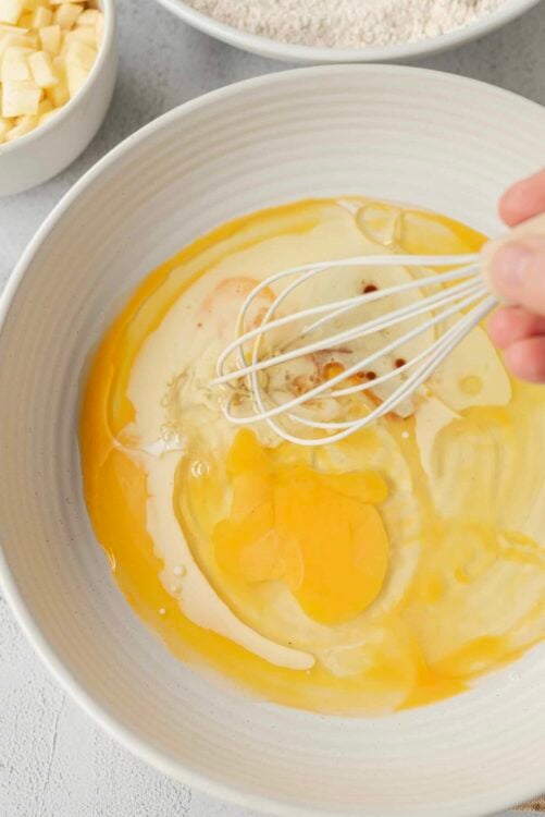 Cream eggs and flour in a mixing bowl for baking recipes.