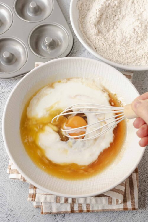 Baked Bree: Baking ingredients with eggs, flour, and a muffin tin for homemade baked goods.