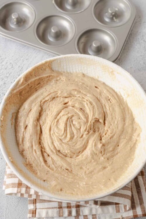 Creamy cake batter in a mixing bowl ready for baking.