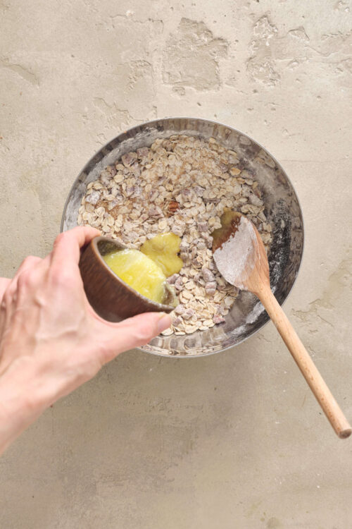 Oatmeal and lemon in a mixing bowl, preparing a healthy breakfast or dessert.