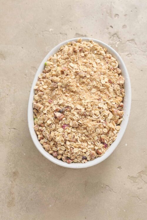 Crunchy homemade granola in an oval white dish.