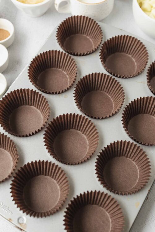 Chocolate cupcake liners in a baking tray ready for baking.