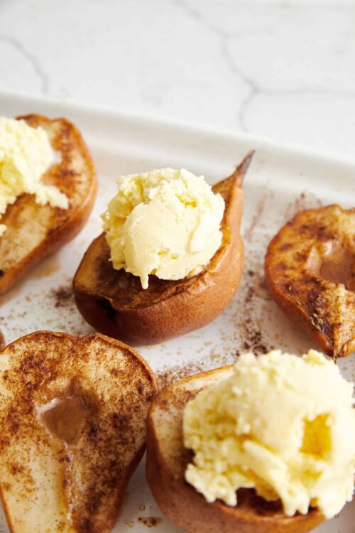 Baked pears with ice cream and cinnamon, served as a delicious, healthy dessert or snack.