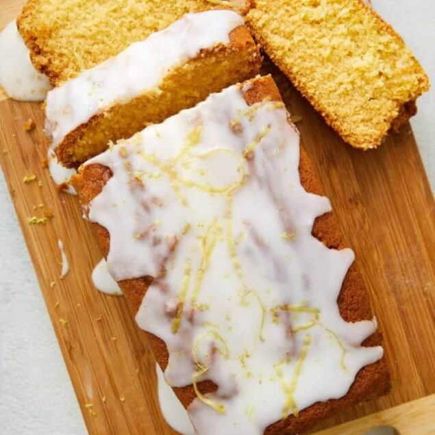 Light Lemon Pound Cake with Lemon Glaze on Wooden Cutting Board, Baked Bree.