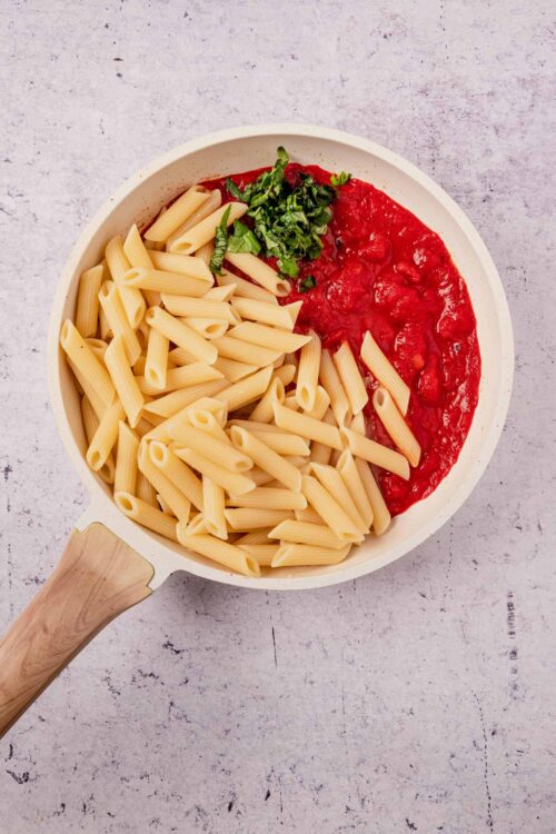 Creamy tomato and basil pasta with penne, ready to cook or serve.