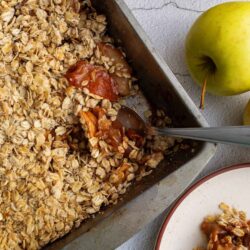 Homemade apple crumble dessert with oats and cinnamon.