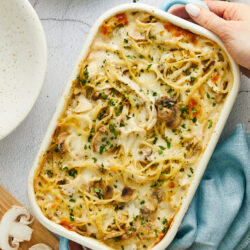 Creamy mushroom chicken spaghetti casserole with melted cheese and fresh herbs.