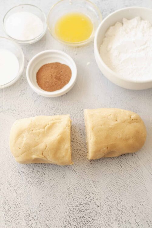 Buttery pie crust dough with baking ingredients for homemade pastry preparation.