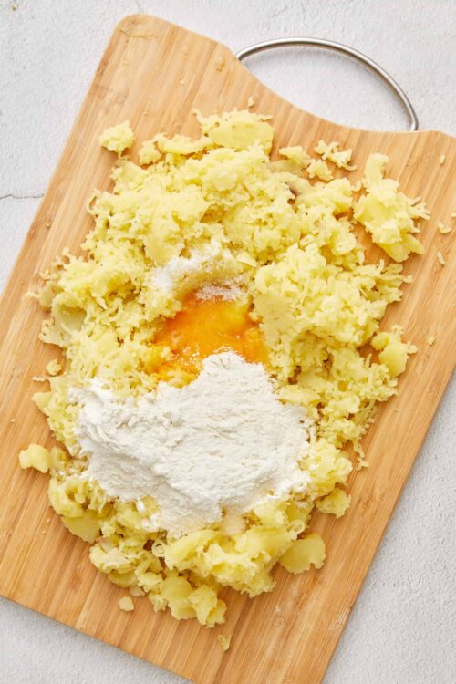 Creamy mashed potatoes with butter, salt, and seasoning ready for serving. Perfect for comfort food recipes.