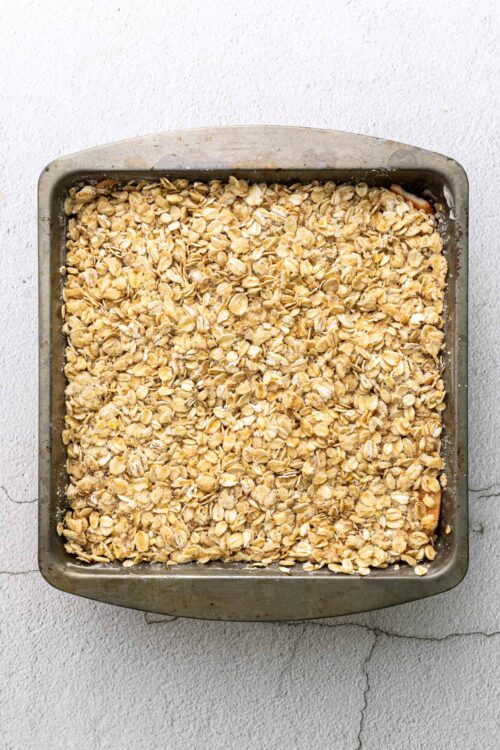 Crunchy oatmeal topping in a baking dish for homemade dessert or breakfast recipes.