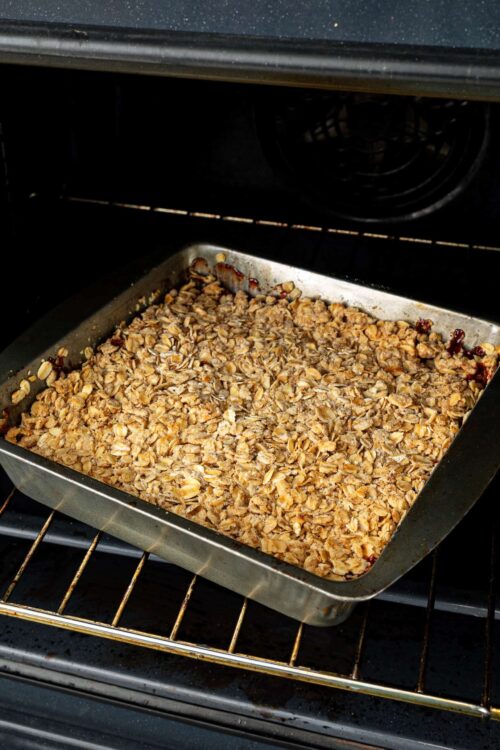 Butterscotch crumble topping baking in oven for dessert.