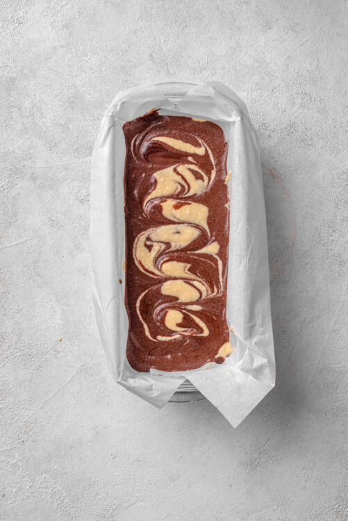 Decadent marble loaf cake with chocolate and vanilla swirls, freshly baked and ready to enjoy.