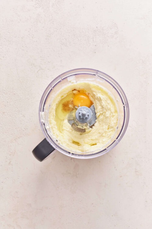 Creamy butter, sugar, and egg in food processor for baking.
