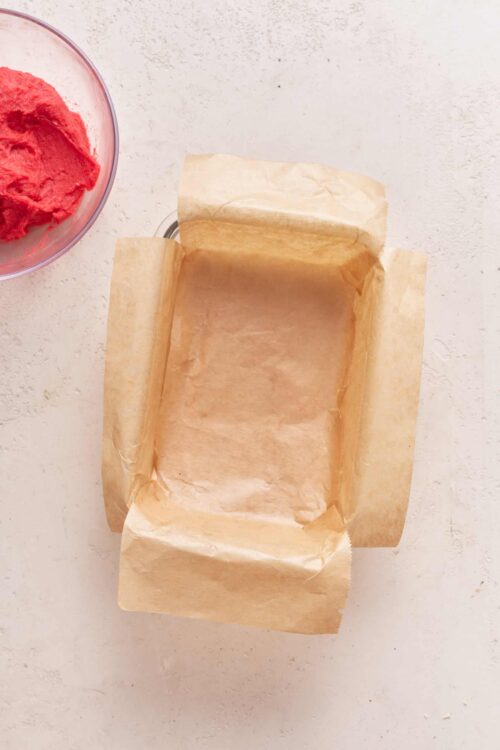 Unlined parchment paper in a baking pan for cake or bread baking.