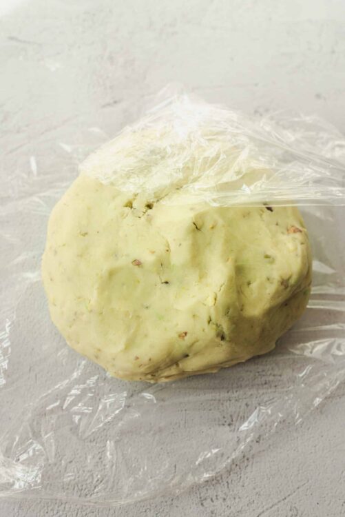 Softened cookie dough balls for baking, ready to be shaped into cookies. Perfect for homemade baked treats.