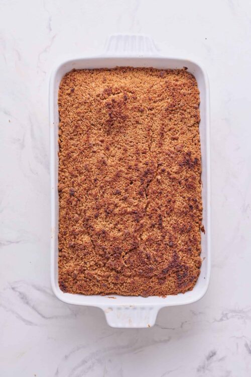 Crumb-topped dessert in a white baking dish, perfect for fall or family gatherings.
