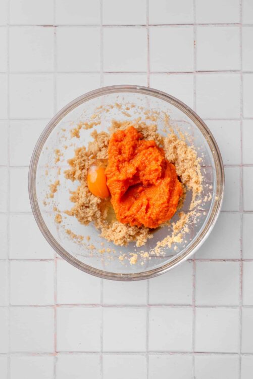 Breadcrumbs and pumpkin puree in a glass bowl for baking recipes.