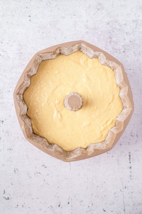 Vanilla cake batter in a Bundt pan ready to bake for homemade dessert.