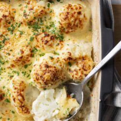 Creamy Cauliflower Gratin with Cheese and Herbs - Baked Bree.