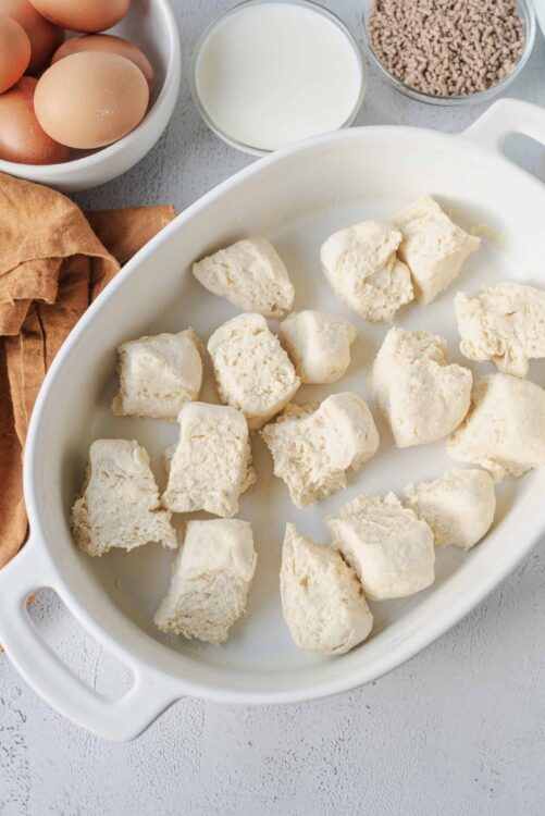 Puff pastry dough pieces in a baking dish for baking or cooking.