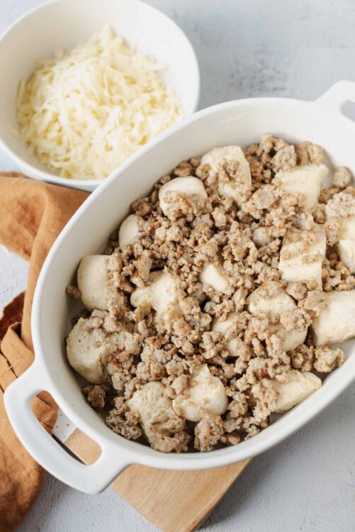 Creamy chicken and dumplings with cooked chicken, dumplings, and savory broth, ready to serve.