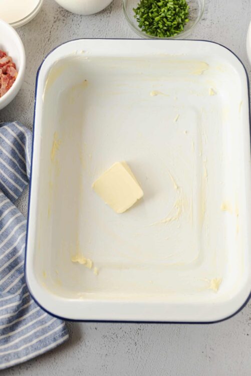 Butter in a baking dish for cooking or baking.