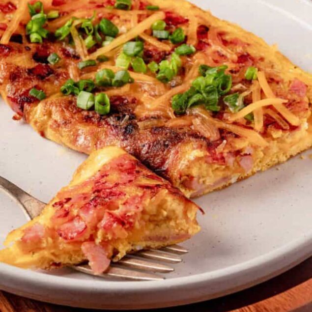 Cheesy bacon and green onion breakfast casserole, baked to perfection.